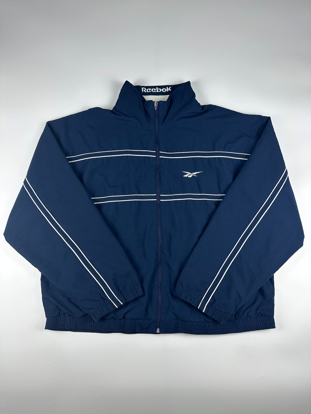 Vintage 90s Reebok Embroidered Logo Spellout Striped Windbreaker Jacket (XL)