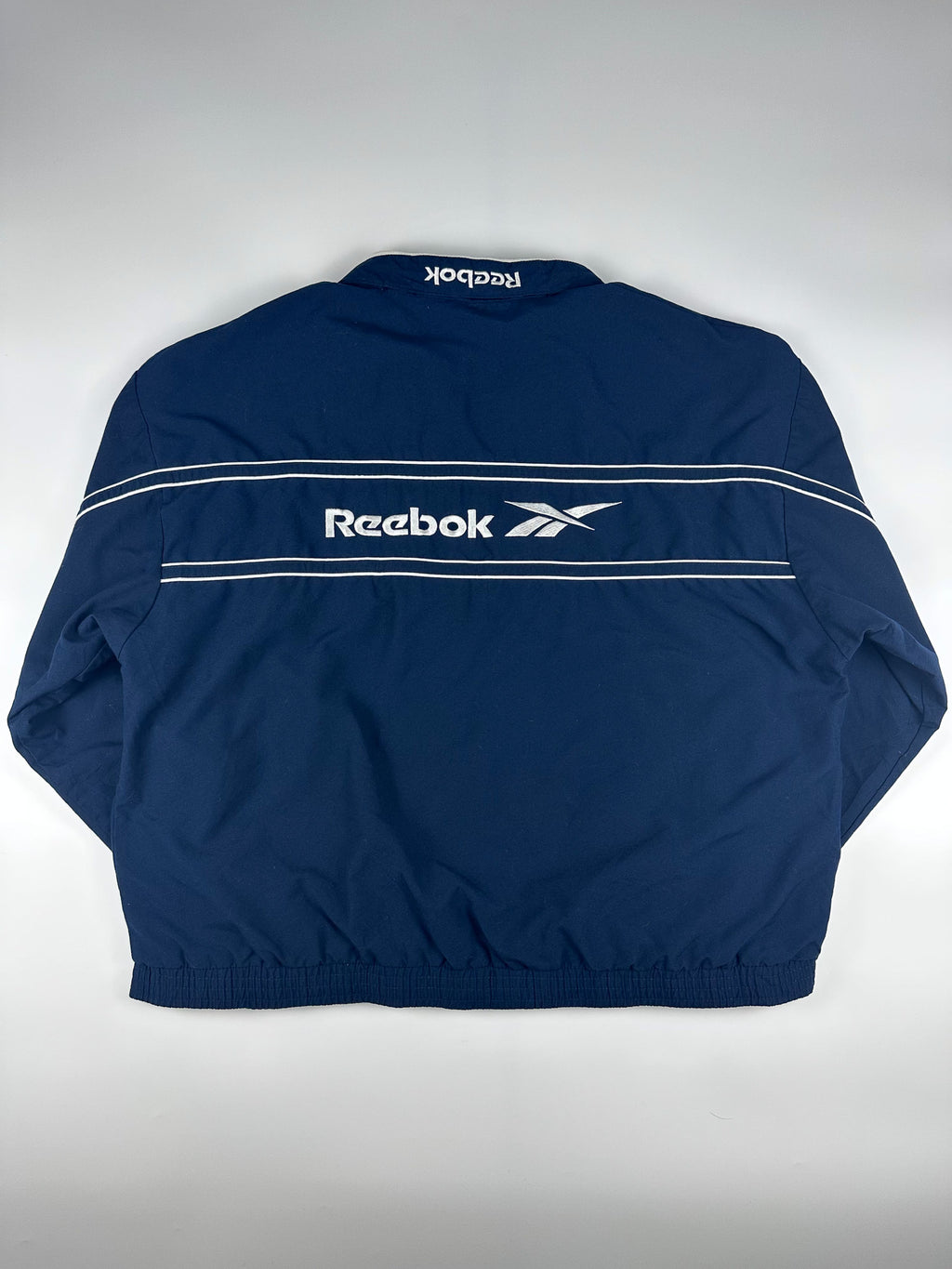 Vintage 90s Reebok Embroidered Logo Spellout Striped Windbreaker Jacket (XL)