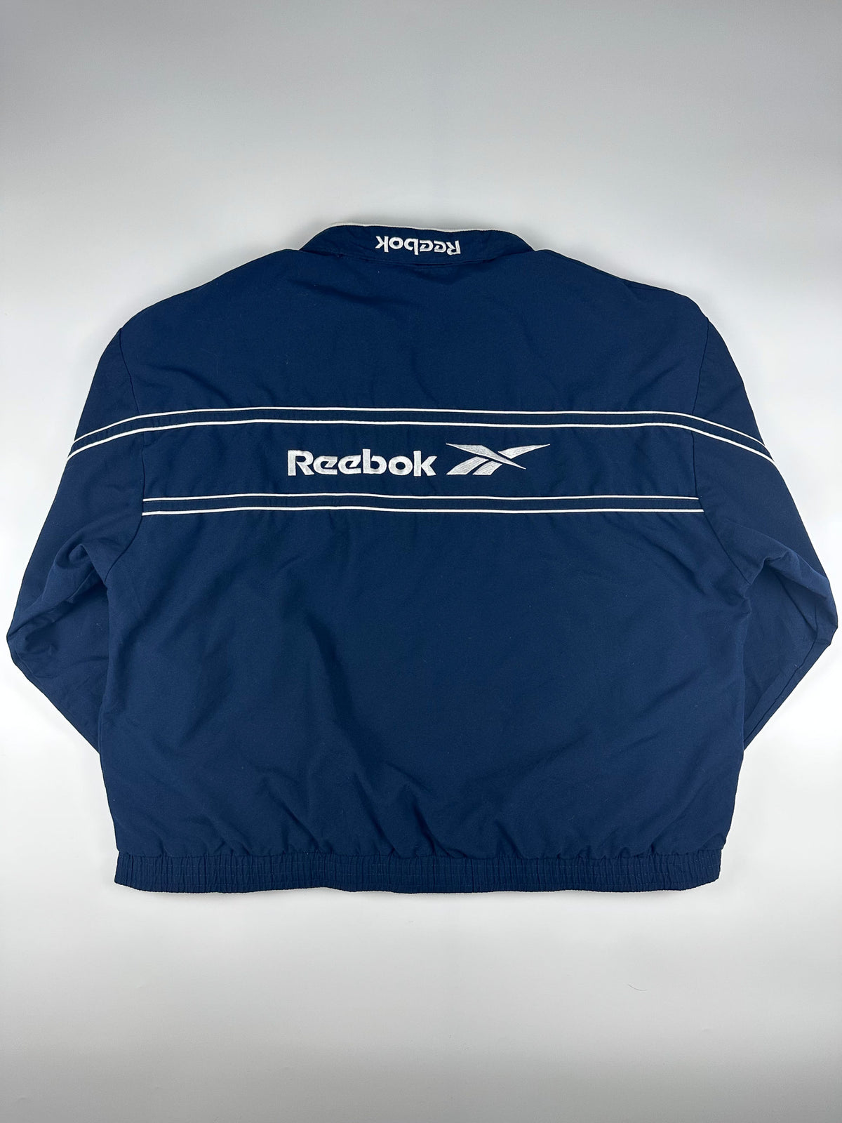 Vintage 90s Reebok Embroidered Logo Spellout Striped Windbreaker Jacket (XL)