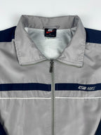 Vintage 90s Nike Embroidered Swoosh Logo Spellout Striped Windbreaker Jacket (XL)