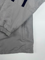 Vintage 90s Nike Embroidered Swoosh Logo Spellout Striped Windbreaker Jacket (XL)